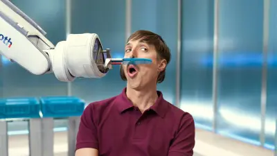 Shawn has his moustache combed by an APAS robot.