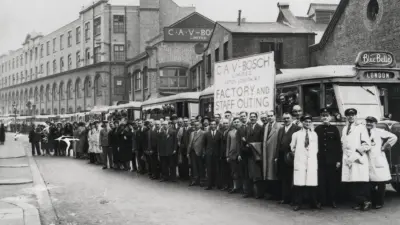 CAV Bosch associates standing outside factory